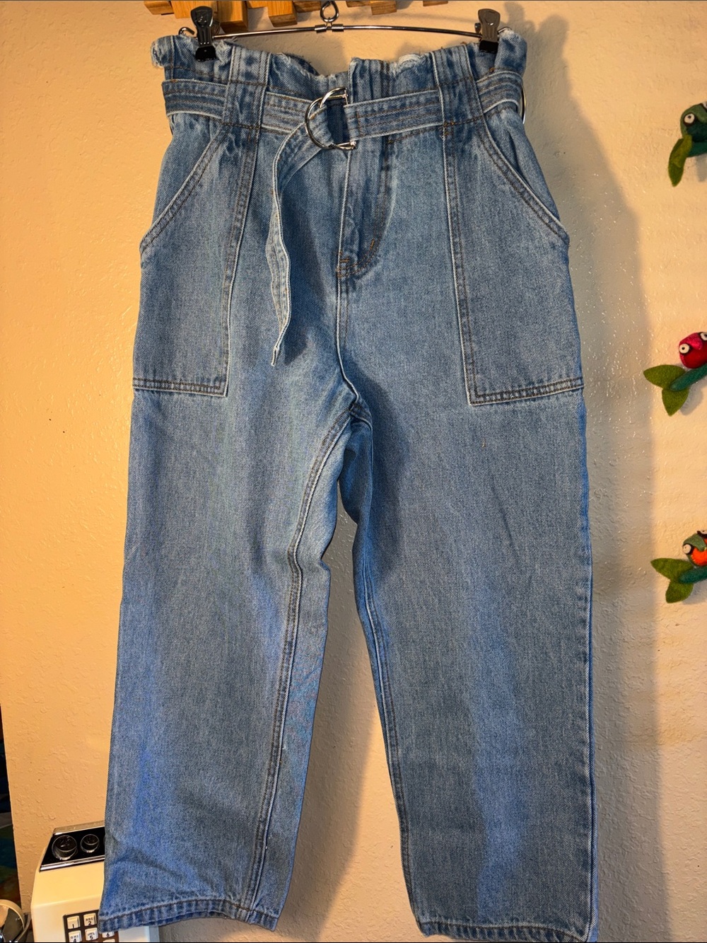 NWOT LULUS light-wash denim pants feature a distinctive paperbag waist with a m